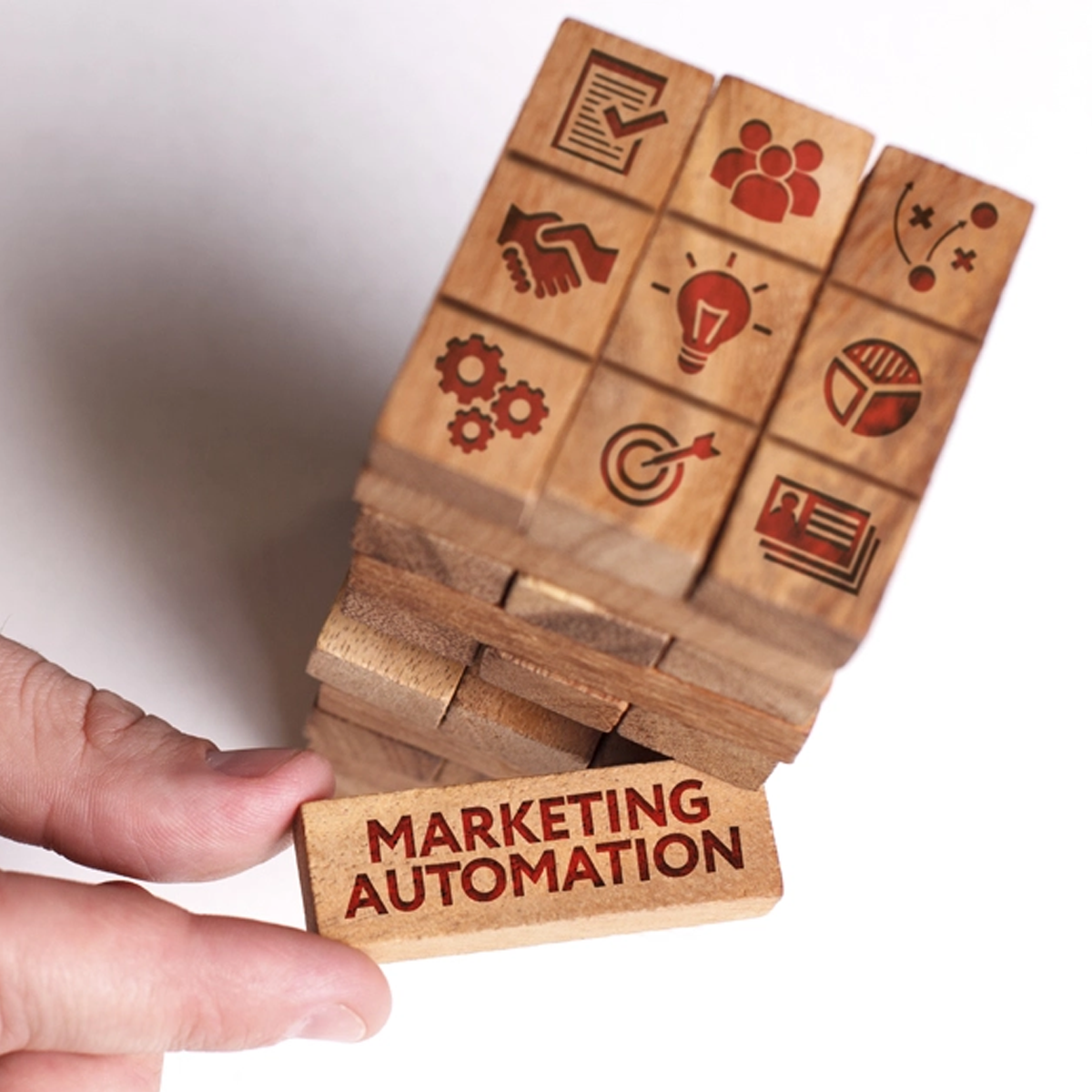 Tacktical Marketing | Thousand Buck Marketing Club | 4 step process for our 4 key areas of service | Picture of jenga blogs representing the different steps that it takes to run Marketing Automation